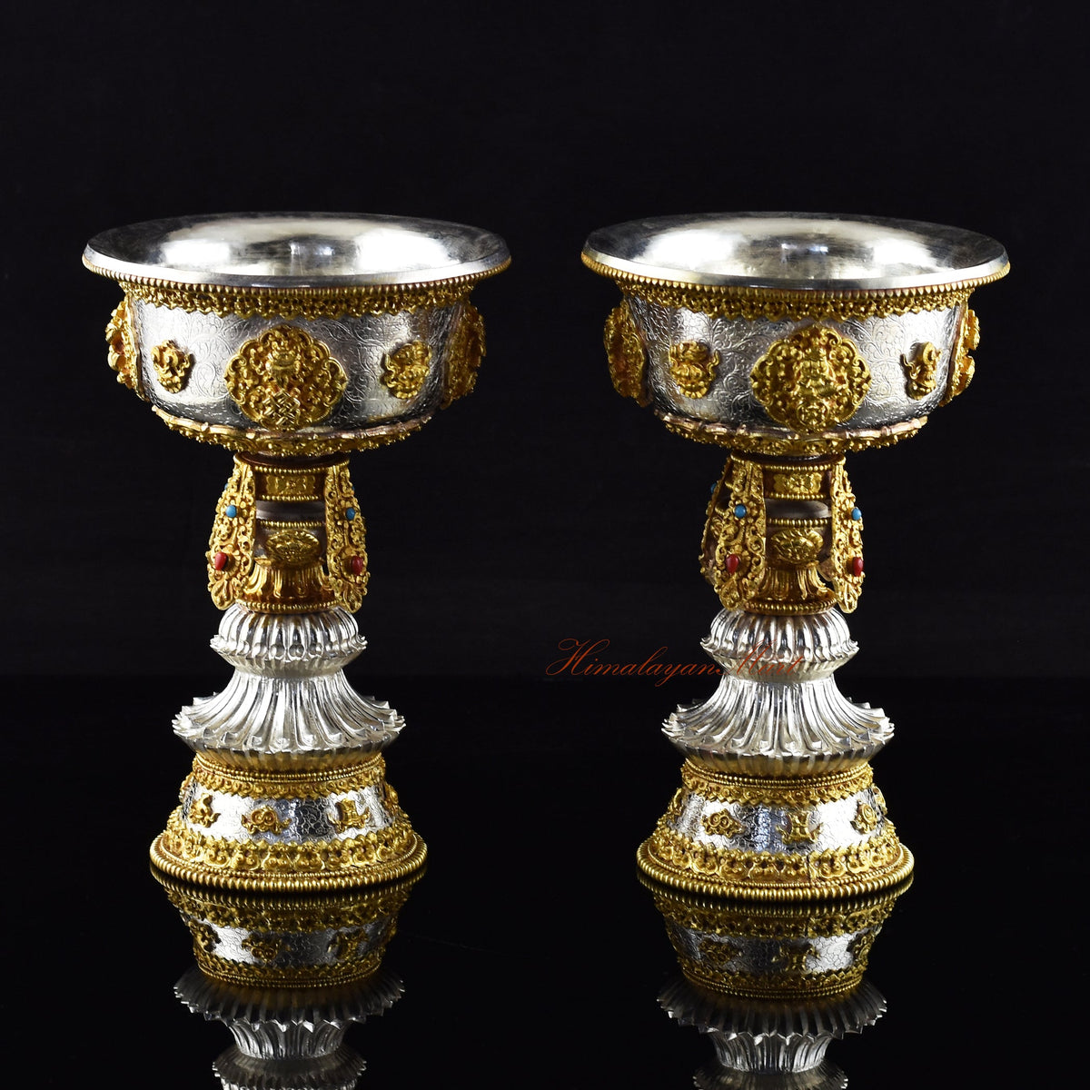 Handcrafted metal butter lamp with lid on a Buddhist altar