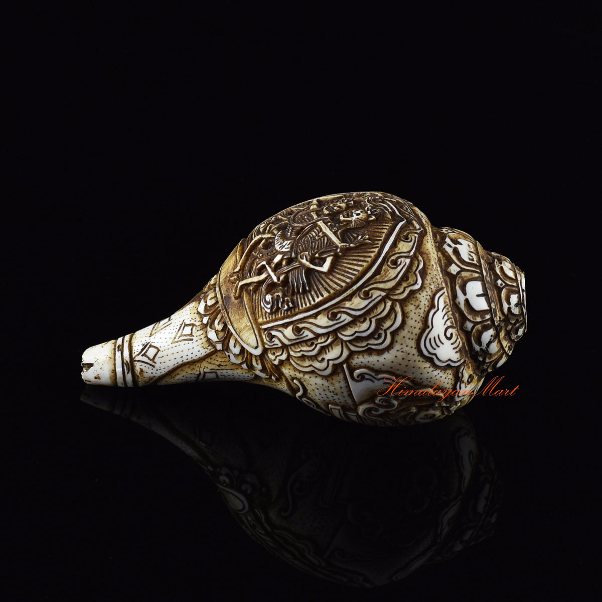 Hand-carved ritual conch shell with metal fittings and stones from Nepal
