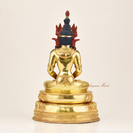 
Rear view of a lost-wax cast Amitayus statue in gold gilded copper alloy, displaying the detailed back carving and craftsmanship of Patan's Newar master artisans, Nepal