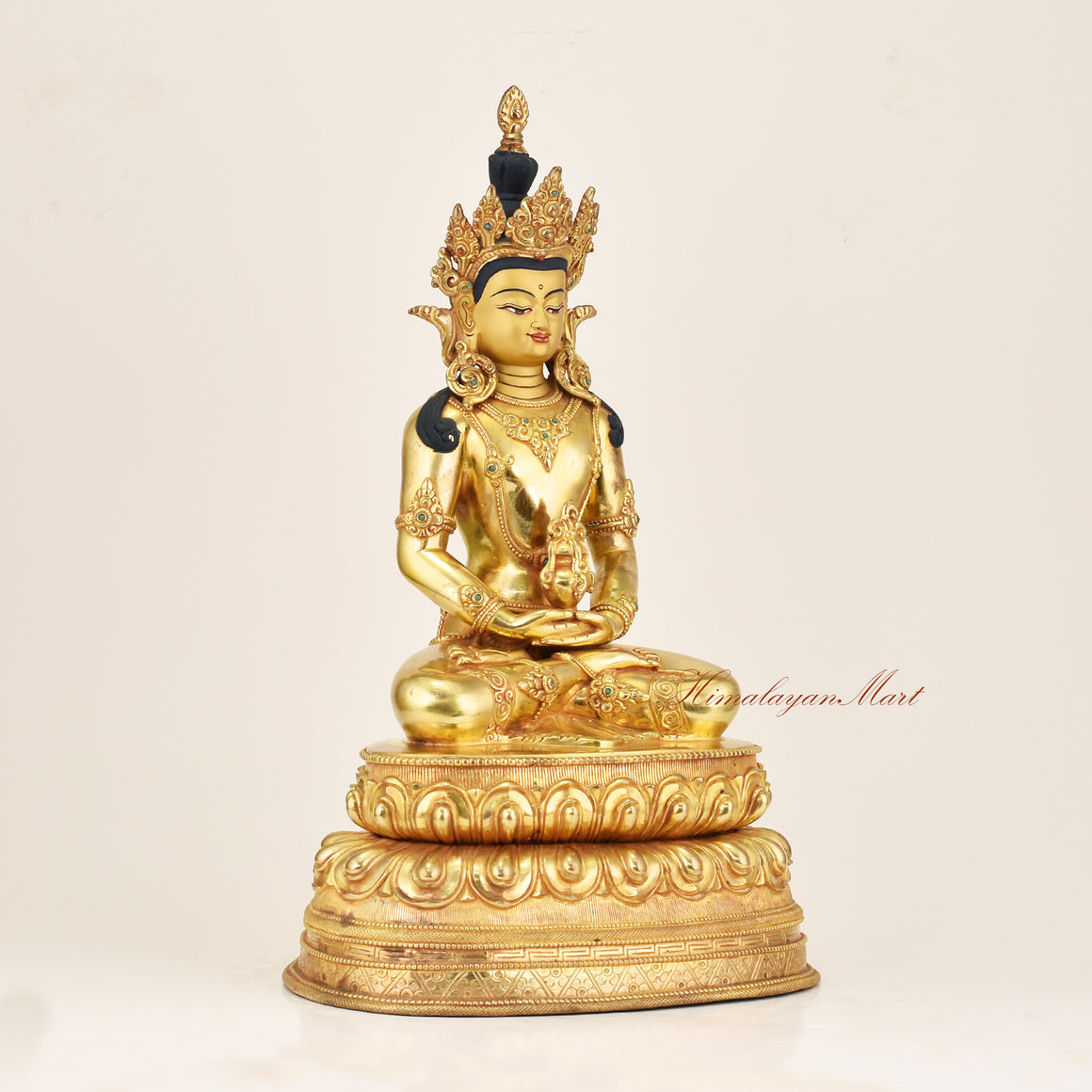Right side view of a gold gilded Amitayus statue in copper alloy, showing flowing robes, jeweled ornaments, and lotus throne detail, made by Newar artisans in Nepal