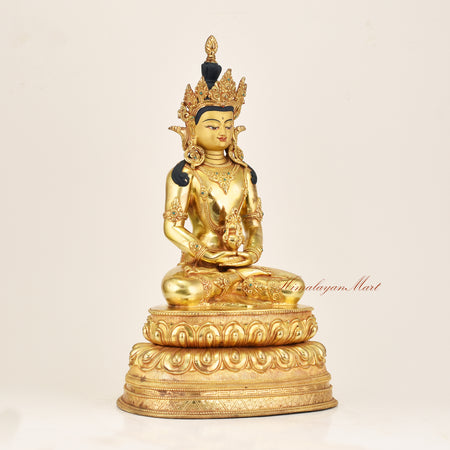 Right side view of a gold gilded Amitayus statue in copper alloy, showing flowing robes, jeweled ornaments, and lotus throne detail, made by Newar artisans in Nepal