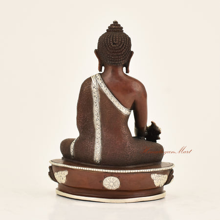 Back view of Antique Medicine Buddha Statue crafted using the traditional Lost-Wax Method