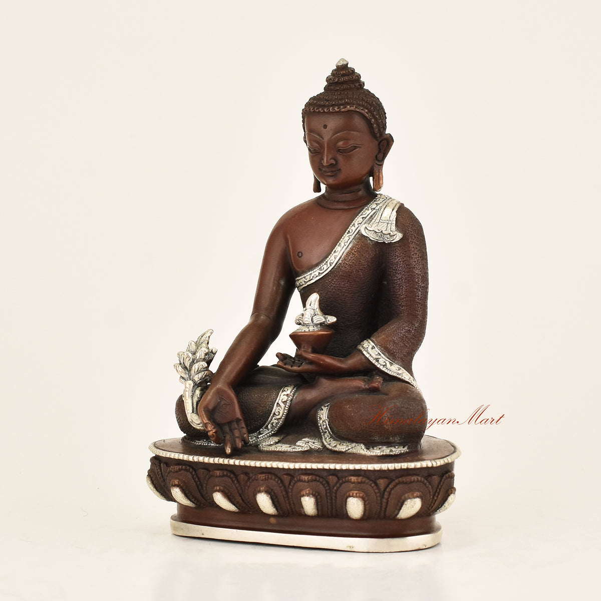 Left side view of Antique Medicine Buddha Statue showing hand-carved detail