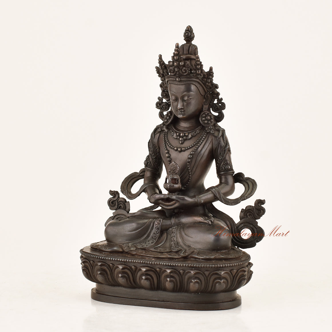 Left side view of the Aparimita Statue revealing intricate copper alloy craftsmanship, armlet adornments, and lotus throne detailing by Nepali master artisans