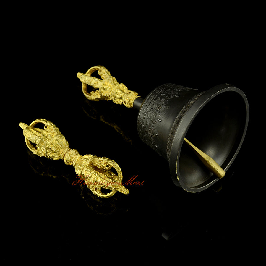 Right side view of hand-engraved Vajra and Bell set showing traditional Buddhist motifs and mantra script on the bronze surface