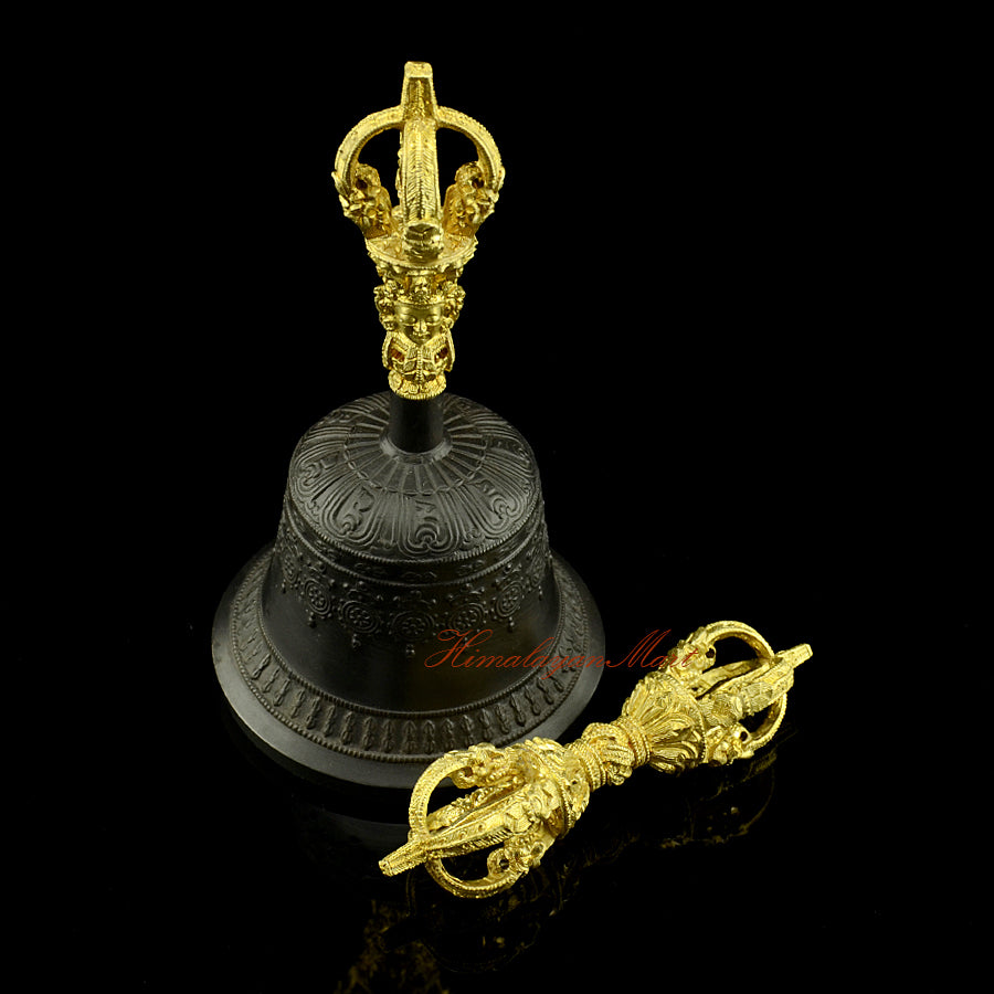 Side profile of Tibetan Buddhist Dorje and Ghanta ritual set showing the five-pronged Vajra form and bell proportions