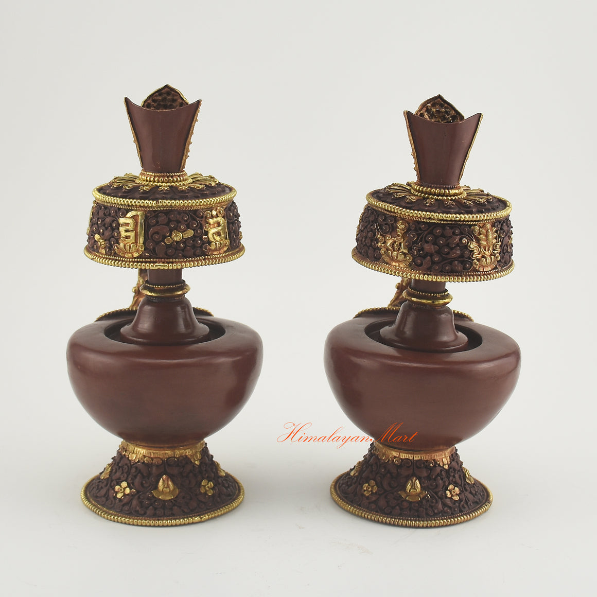 Back view of the Bhumba Ritual Container showing intricate hand-carved Buddhist motifs and polished gold-plated finish.