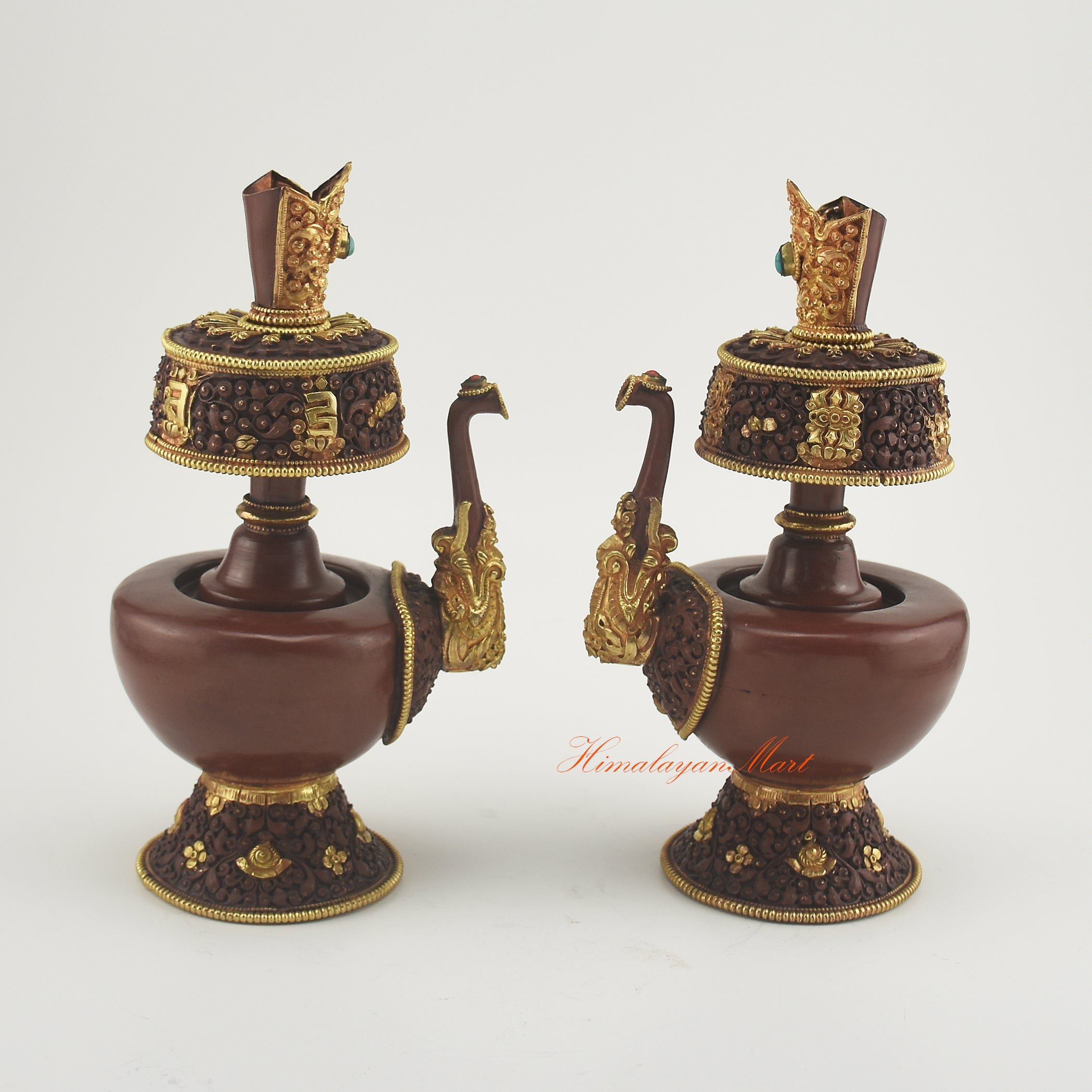 Pair of Bhumba Ritual Containers placed together, showcasing artisan craftsmanship with gold plating and semi-precious stones.