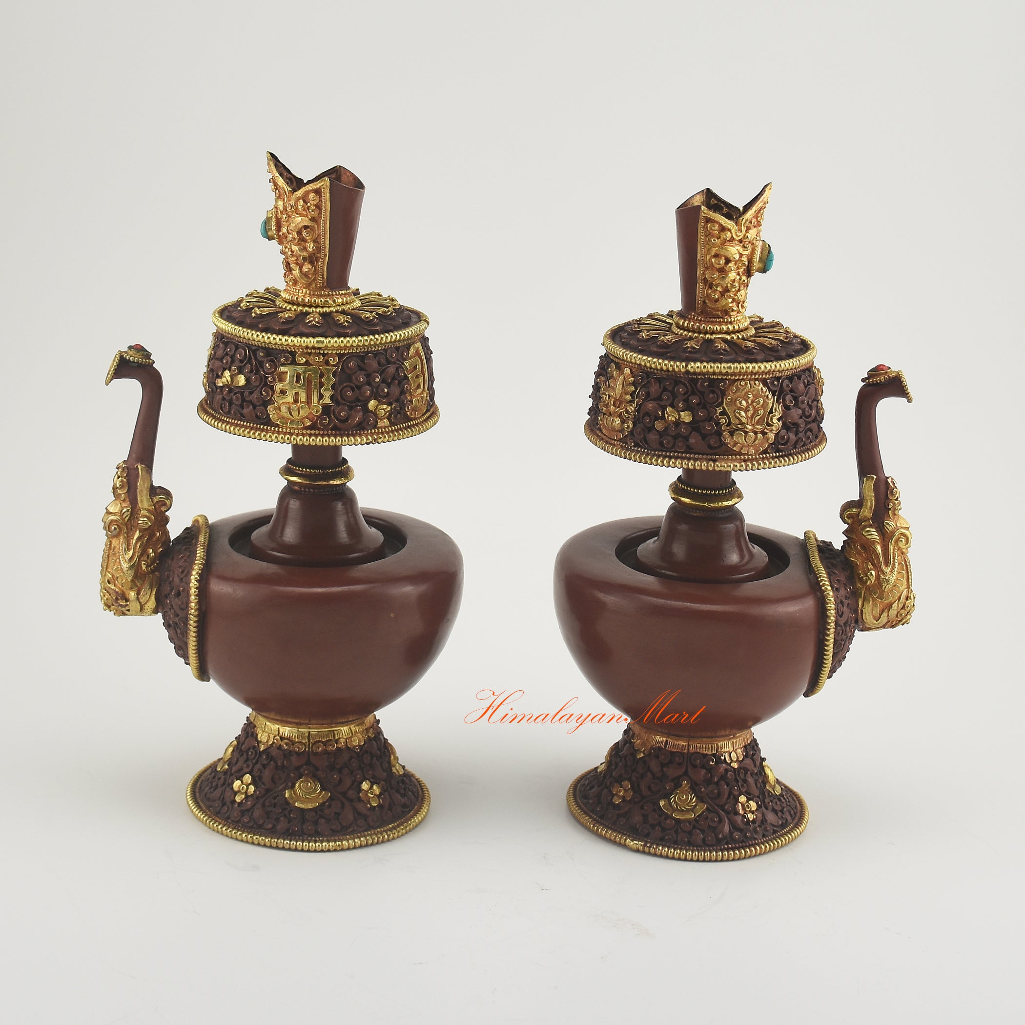 Outward-facing view of Bhumba Ritual Container highlighting hand-carved Buddhist designs and decorative coral and turquoise stones.