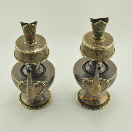 Top view of Bhumba Sacred Ritual Vase showing brass rings and detailed hand carvings with coral and turquoise inlays