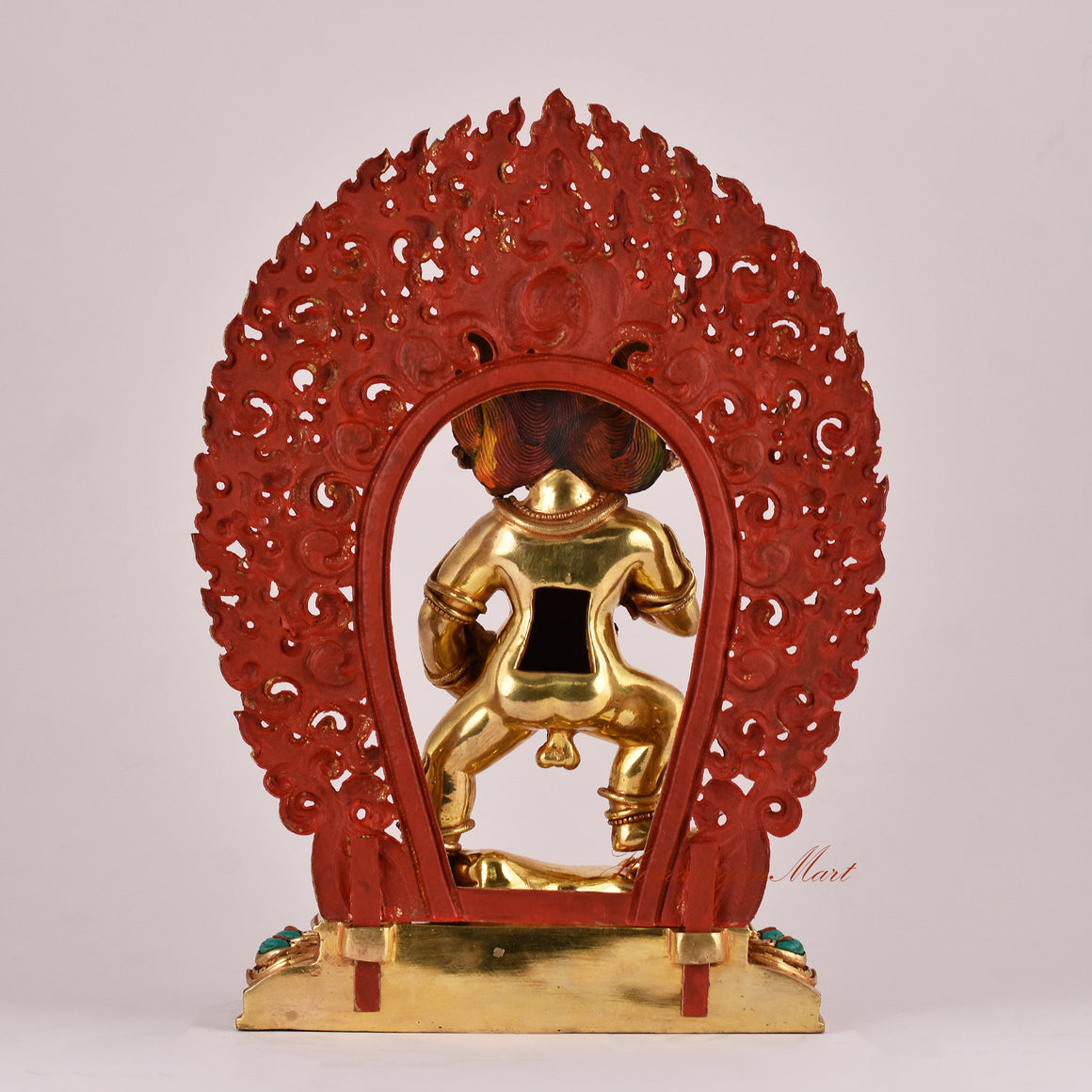 Back view of the Black Dzambhala Statue displaying traditional carvings and detailed robe patterns.