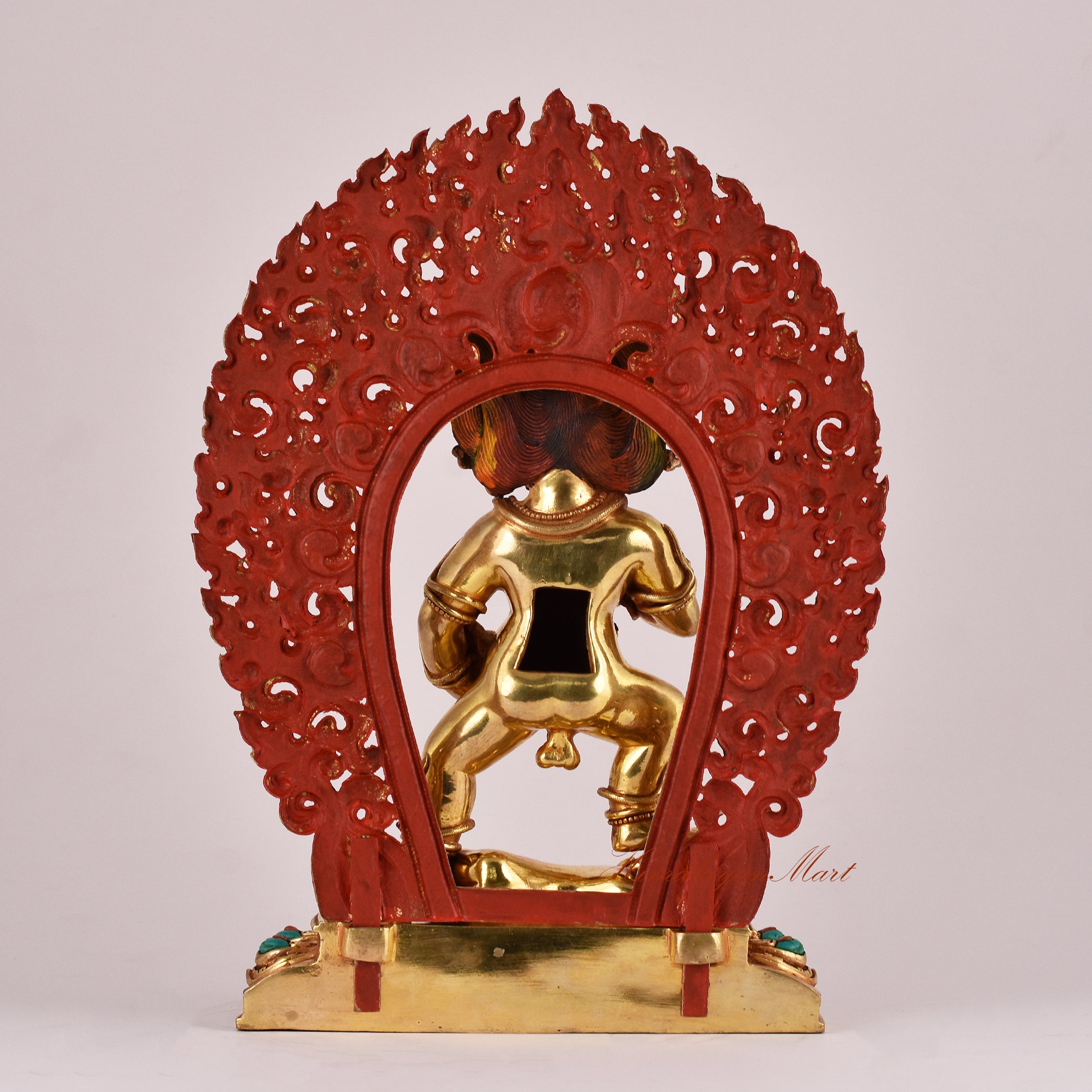 Back view of the Black Dzambhala Statue displaying traditional carvings and detailed robe patterns.