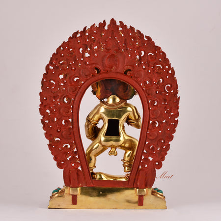 Back view of the Black Dzambhala Statue displaying traditional carvings and detailed robe patterns.