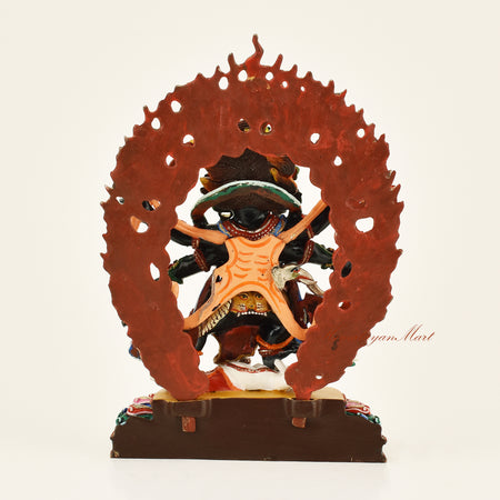 Back view of the Black Mahakala Dharmapala statue with wooden frame