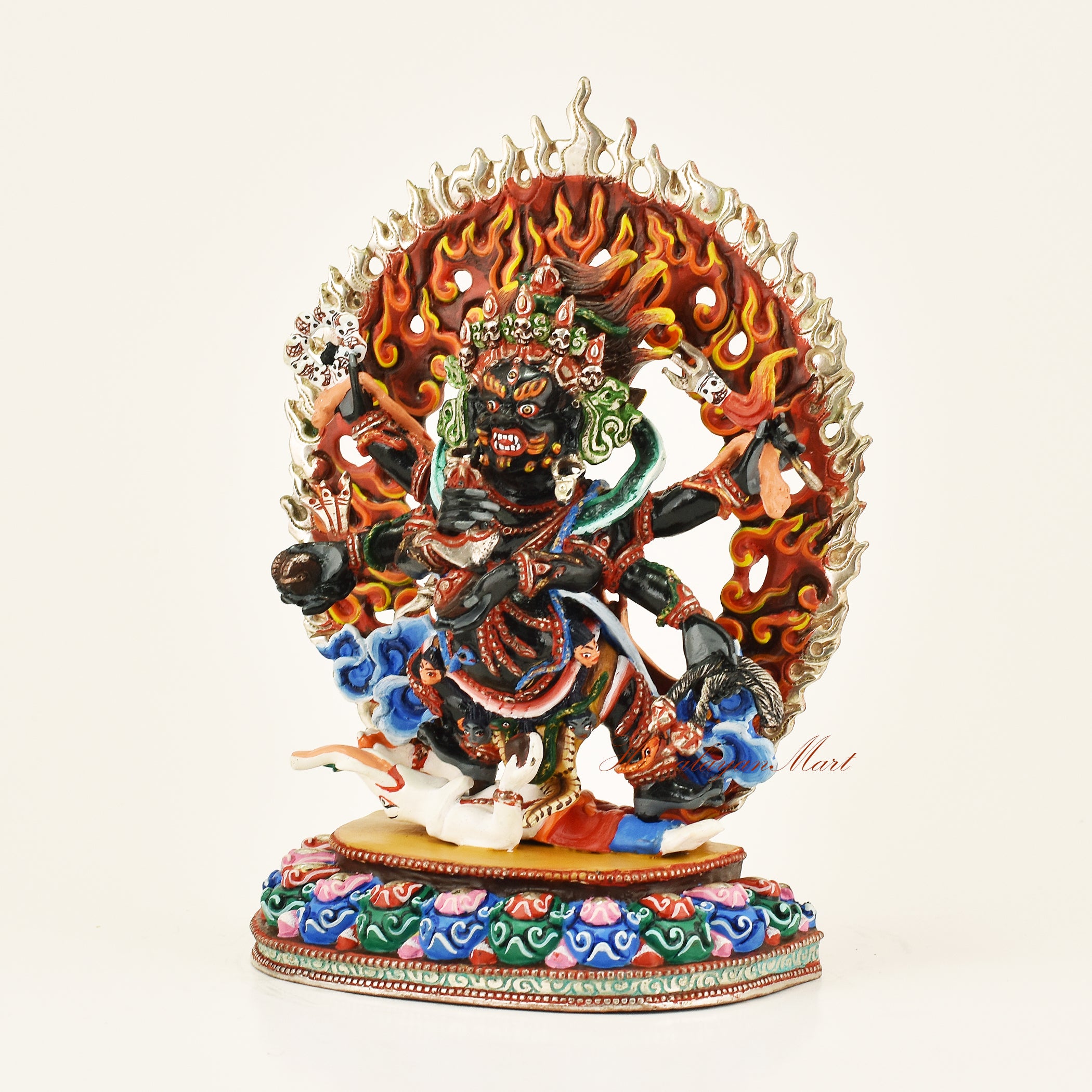 Left side view of the Black Mahakala Dharmapala statue with gold gilded finish