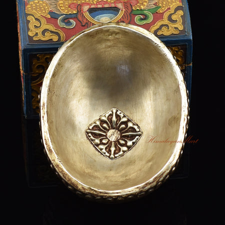 Black Mahakala resin kapala, back view of Tibetan Buddhist altar piece
