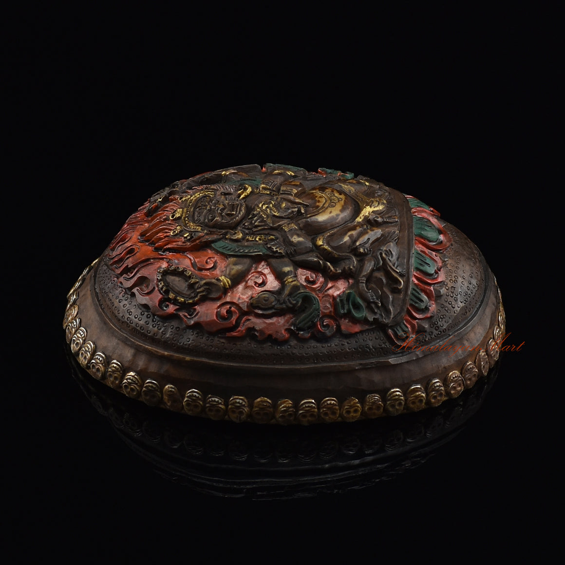 Black Mahakala resin kapala, left side view showing metal skull detailing