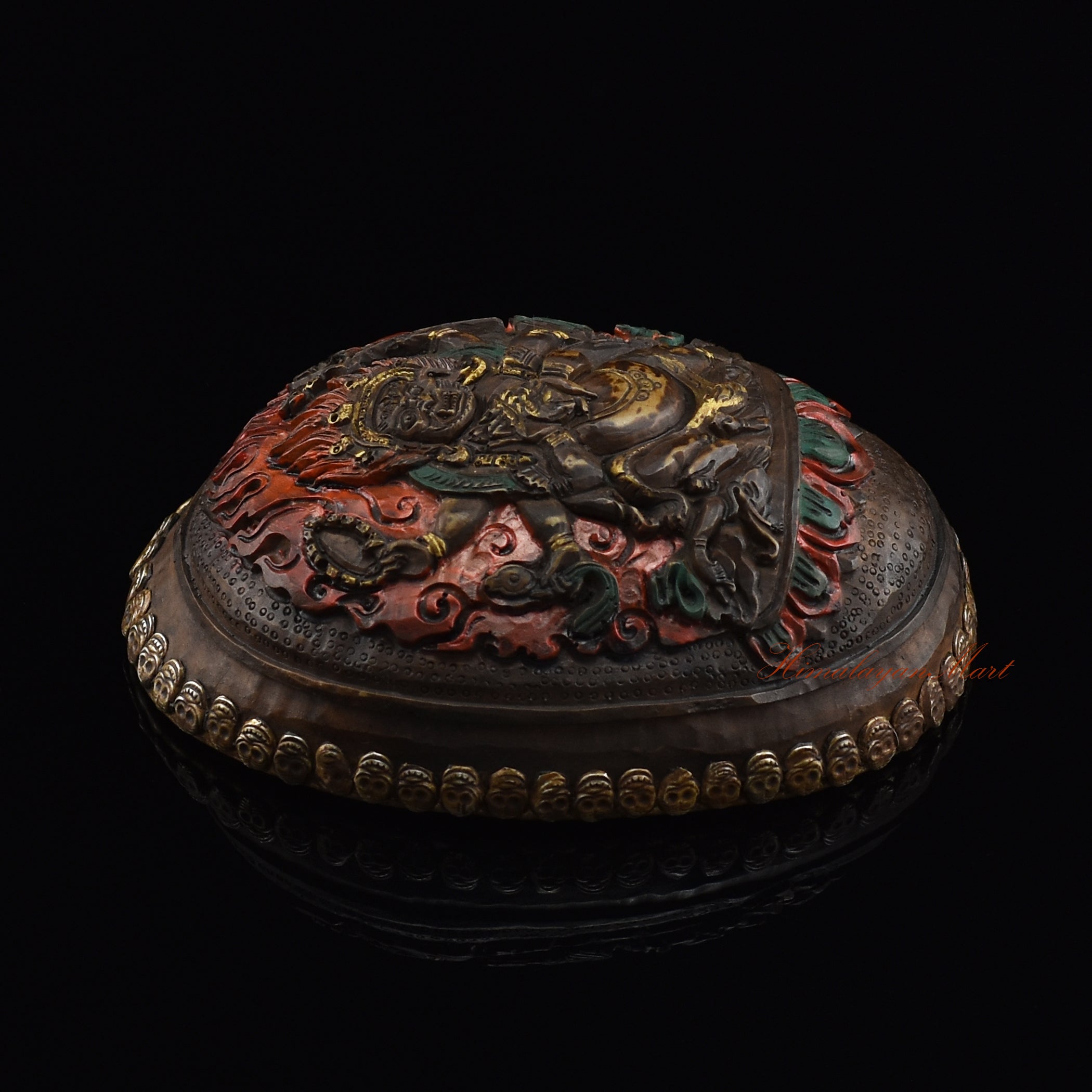 Black Mahakala resin kapala, left side view showing metal skull detailing