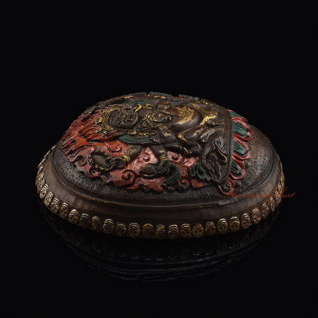 Black Mahakala resin kapala, left side view showing metal skull detailing