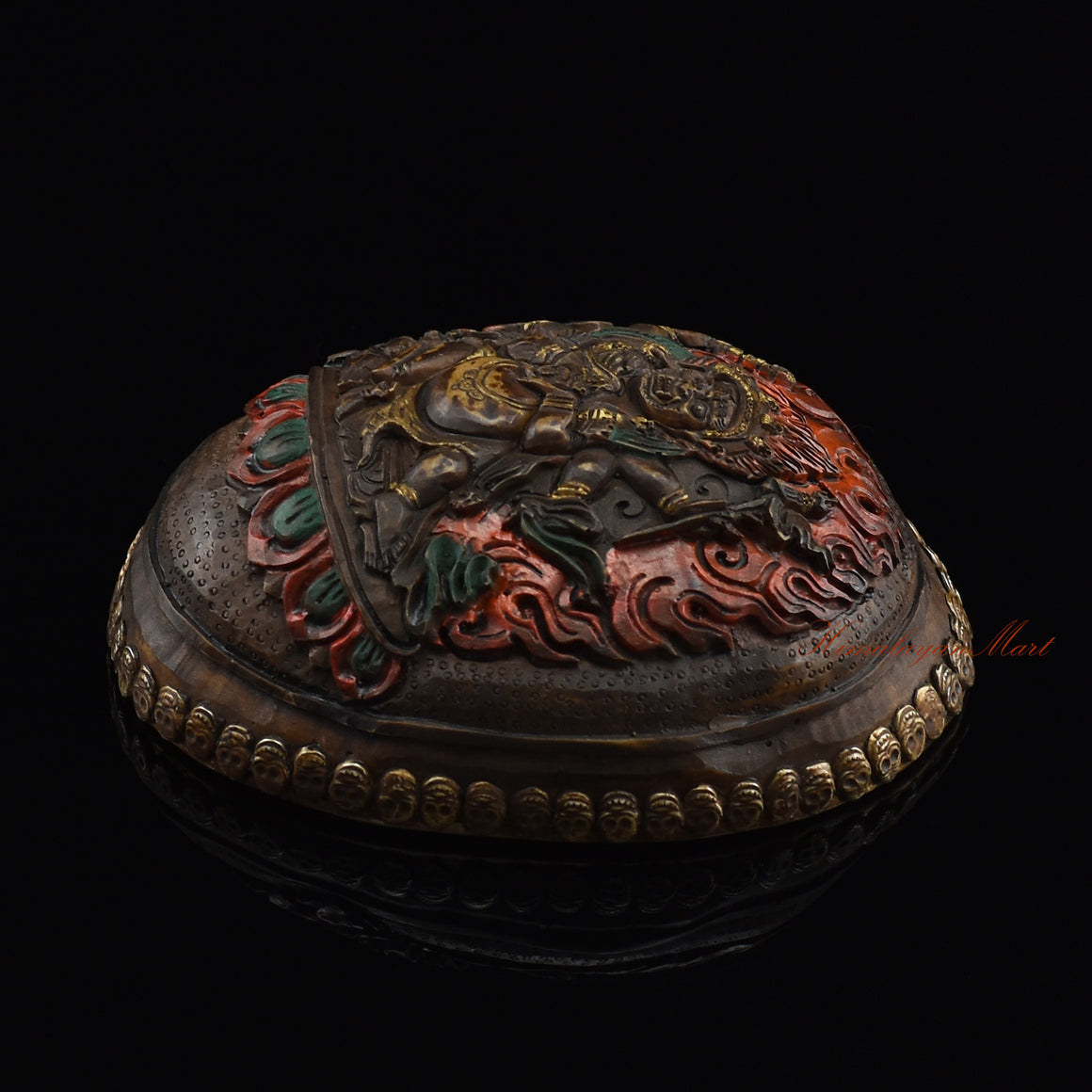 Black Mahakala resin kapala, right side view with silver-plated copper accents