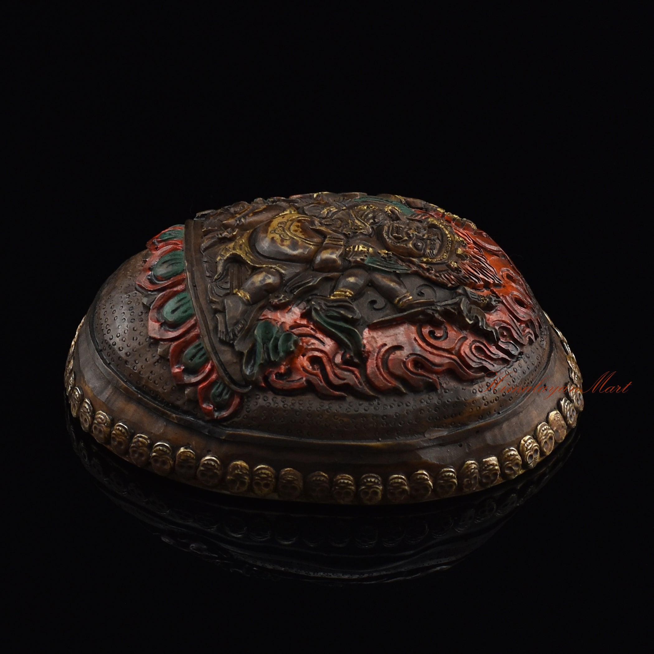 Black Mahakala resin kapala, right side view with silver-plated copper accents