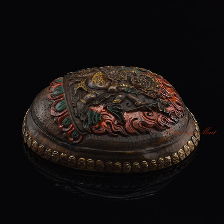 Black Mahakala resin kapala, right side view with silver-plated copper accents