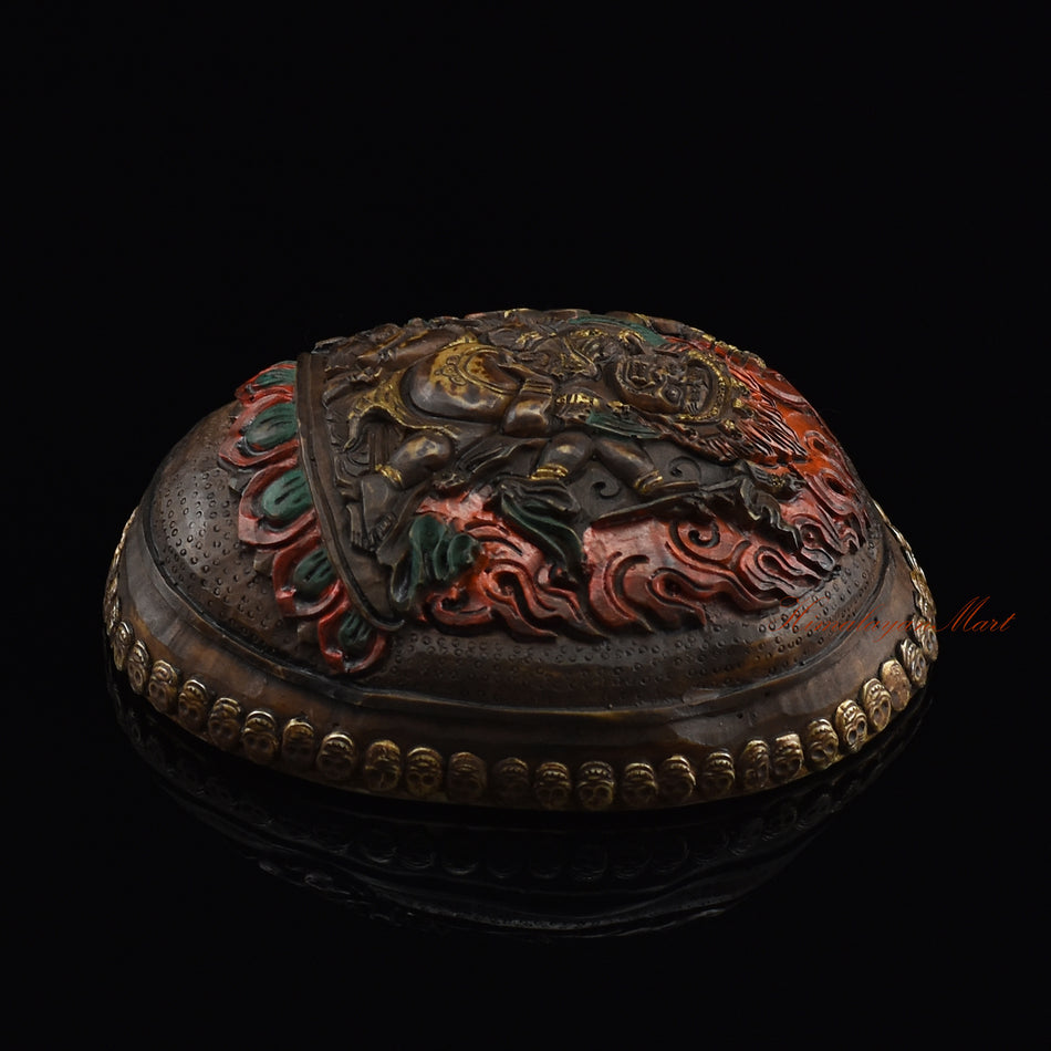 Black Mahakala resin kapala, right side view with silver-plated copper accents