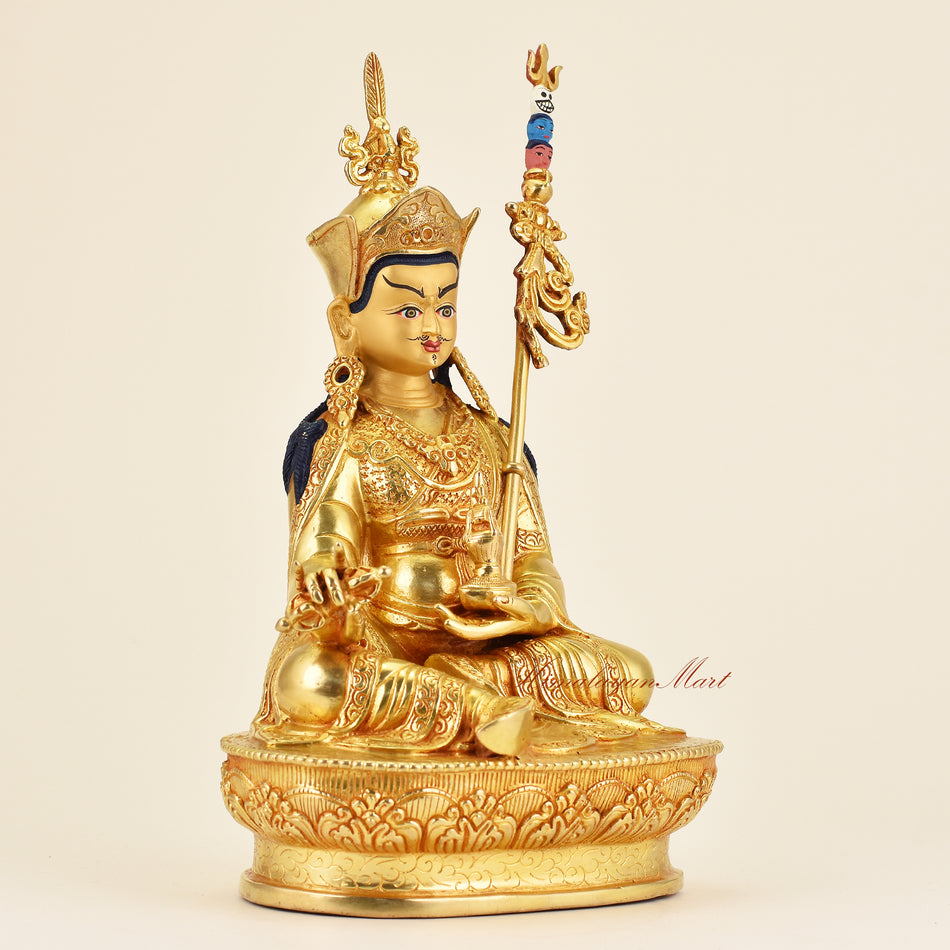 Right-side view of Buddhist Guru Padmasambhava statue in premium gold gilded finish, showcasing fine hand-carved details and sacred artisan work.