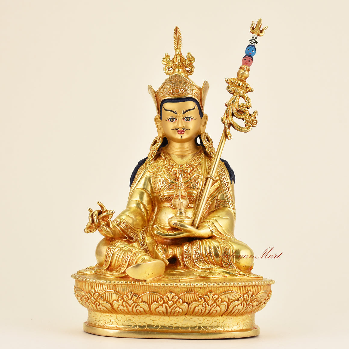 Front view of Buddhist Guru Padmasambhava statue, premium gold gilded handmade sacred art with intricate details and traditional Himalayan craftsmanship.