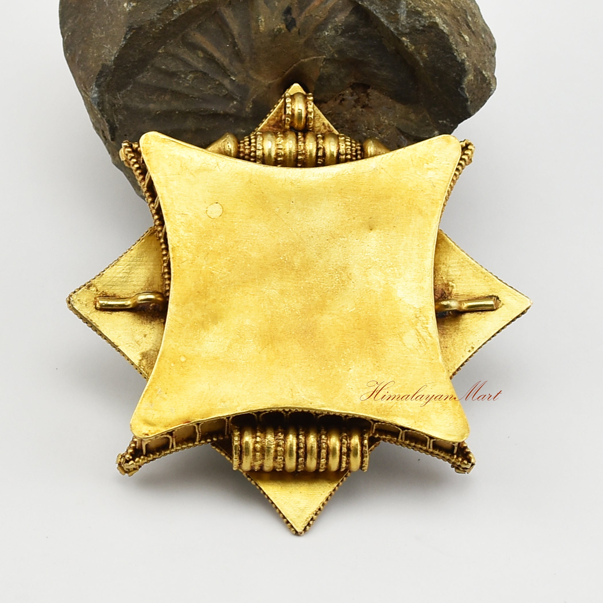 Back view of the Buddhist Religious Prayer Box Pendant highlighting gold-plated craftsmanship and detailed Siko carvings.