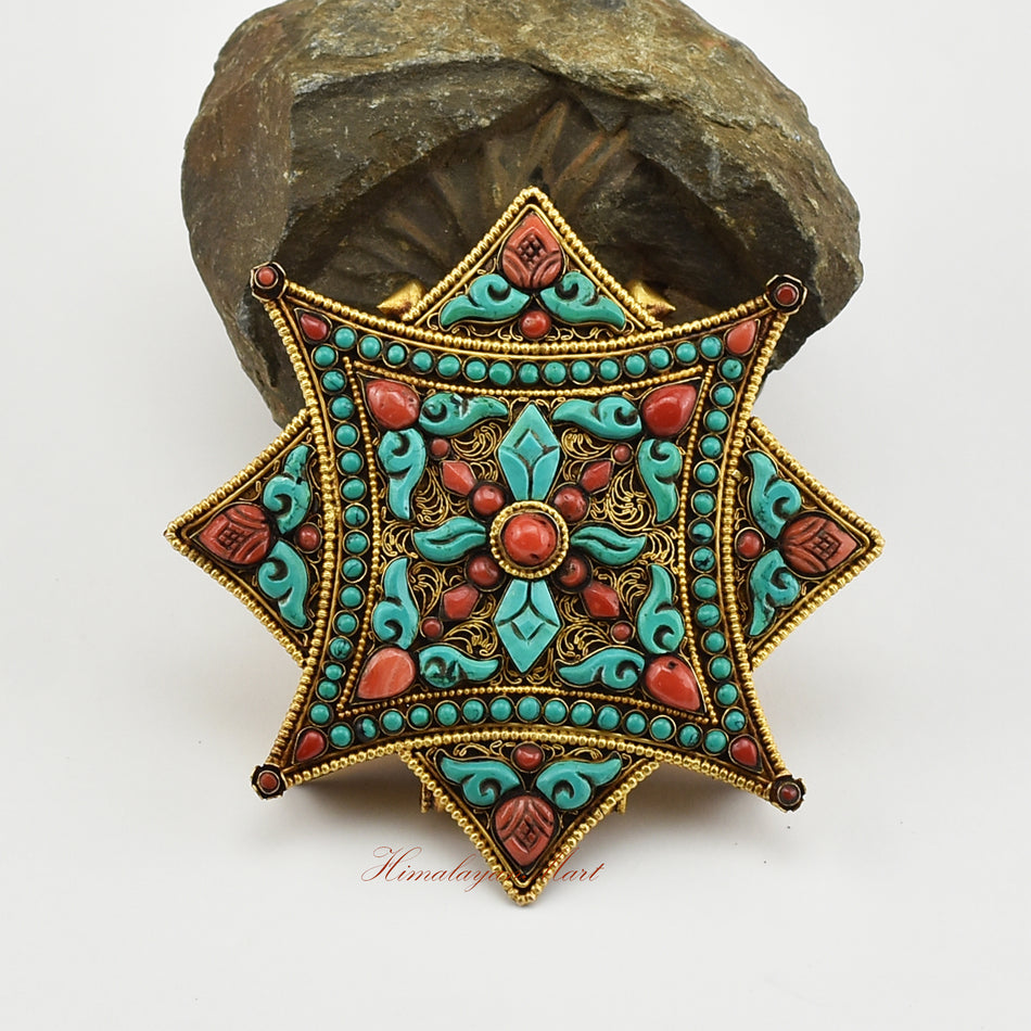 Front view of the Buddhist Religious Prayer Box Pendant showing intricate filigree work and coral and turquoise stones.