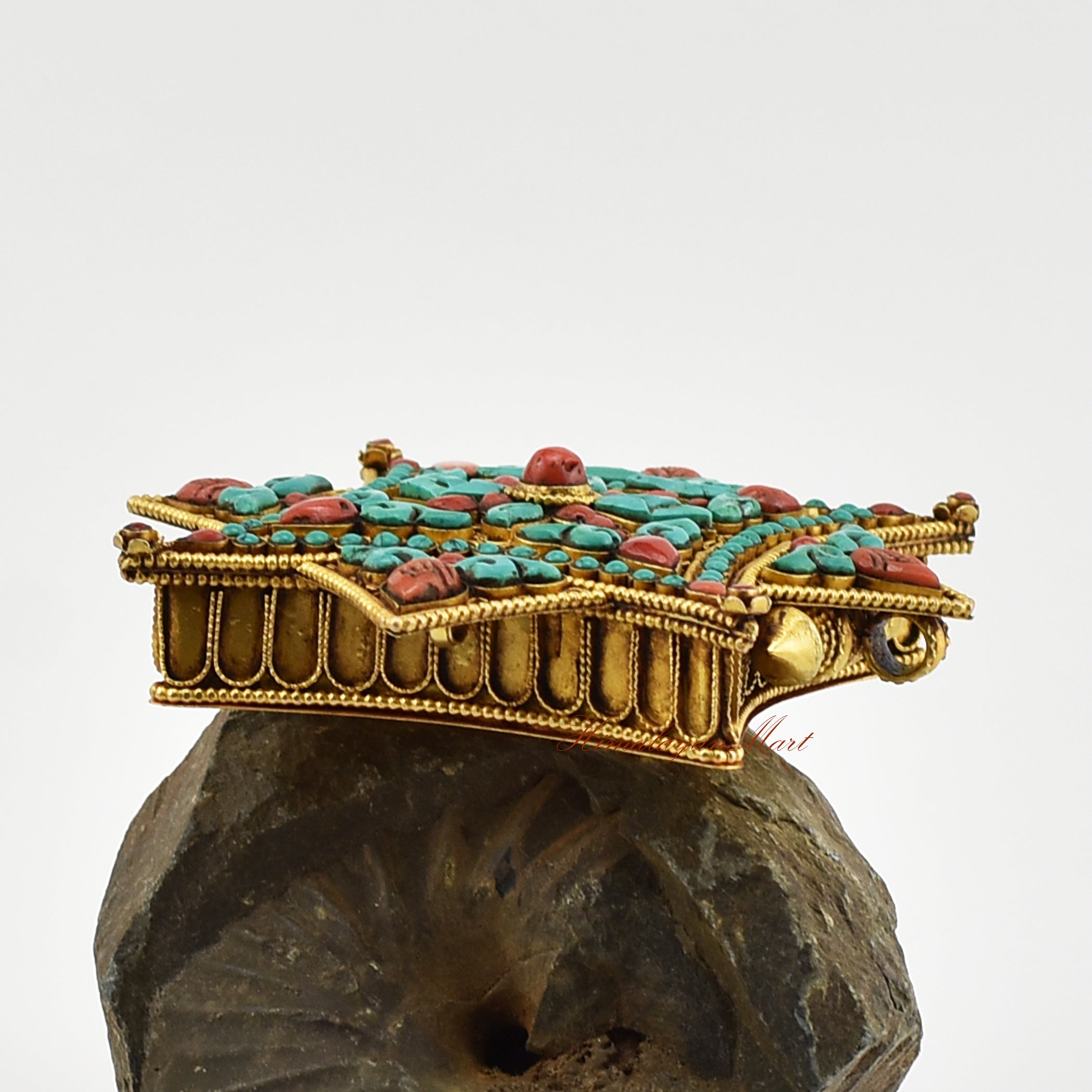 Right-side view of the Buddhist Religious Prayer Box Pendant showing detailed filigree work and coral and turquoise embellishments.