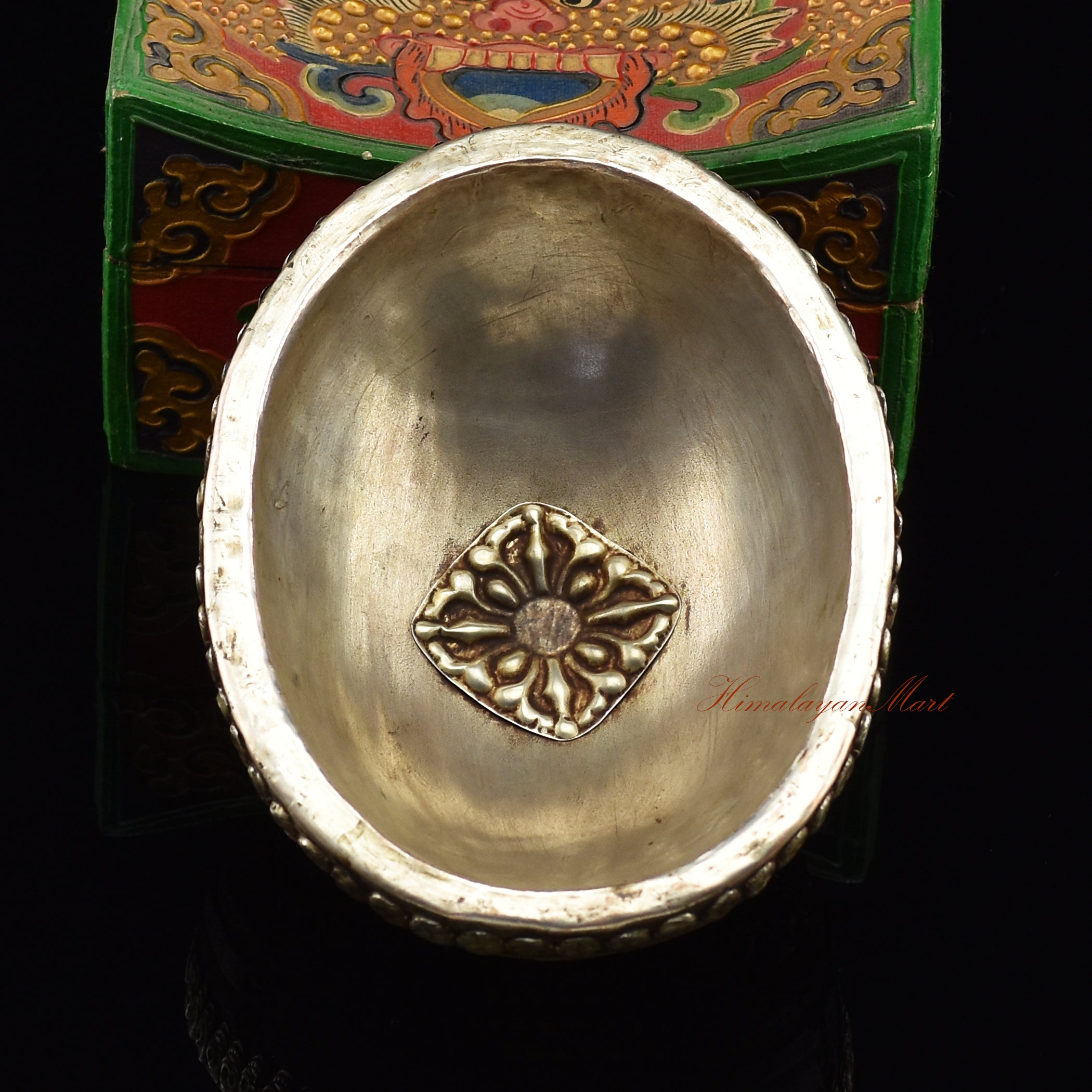 Chenrezig carved resin kapala, back view of Buddhist altar piece
