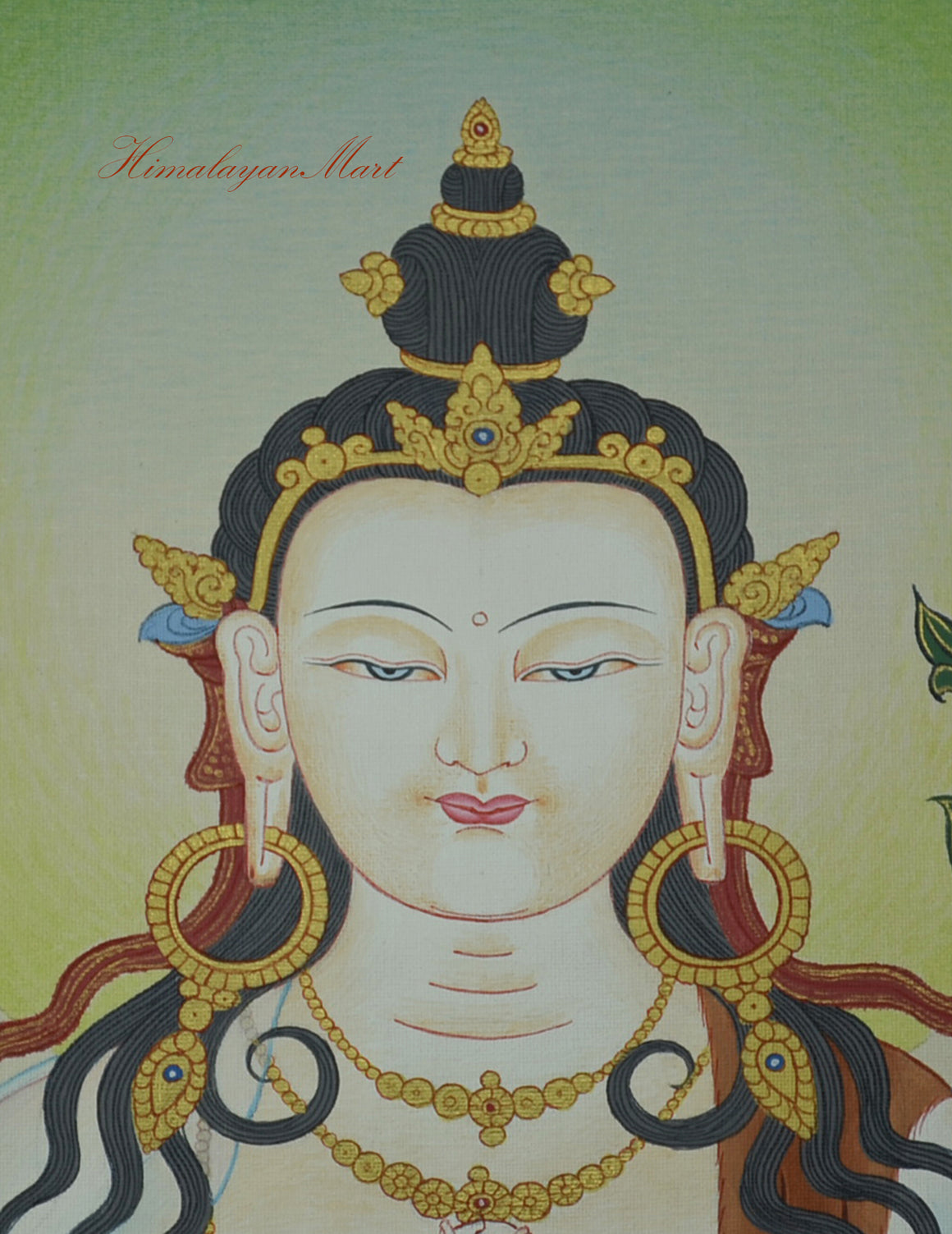 Close-up of Chenrezig’s serene facial expression in the hand-painted Karma Koti Thangka.