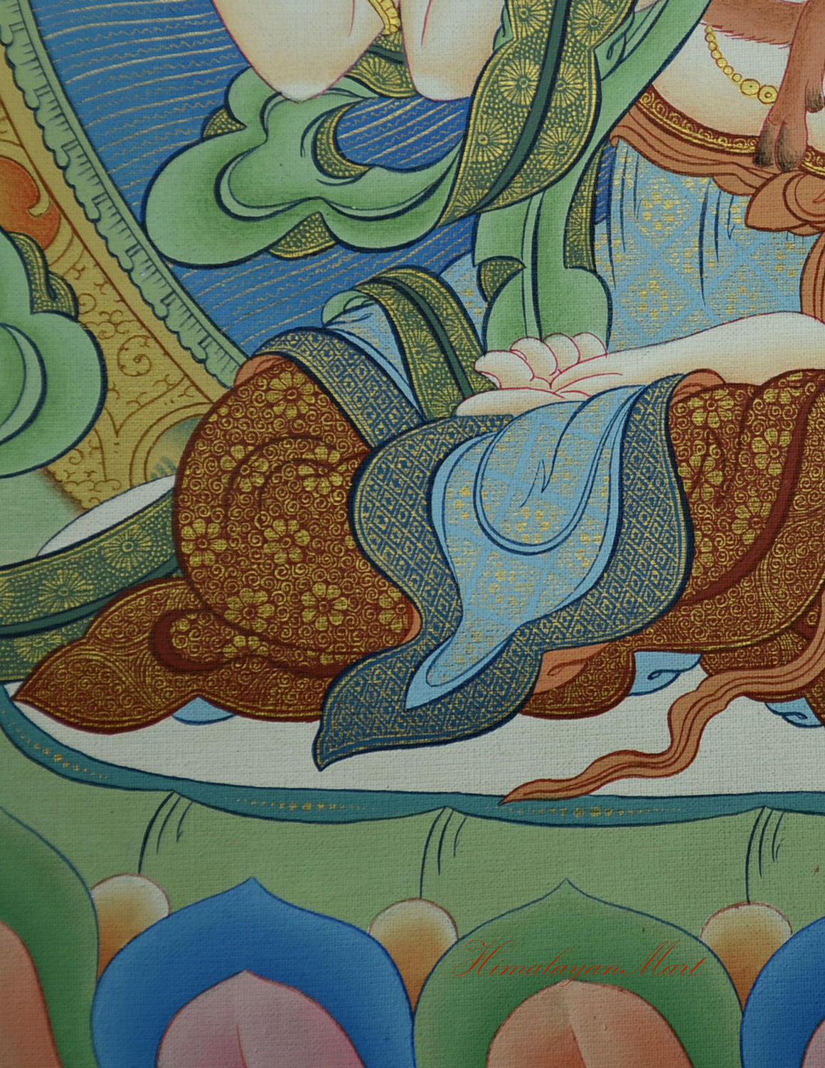 Detail of Chenrezig’s seated posture with flowing robes on the lotus throne.