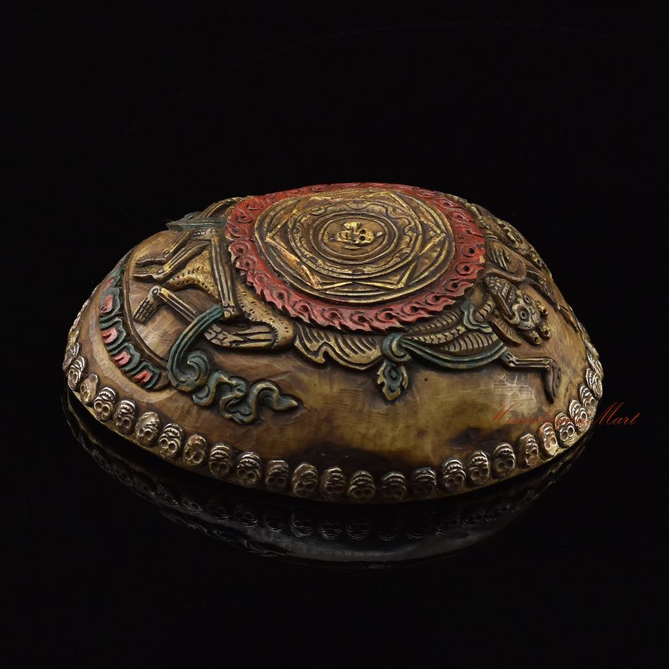 Right side view of the Citipati Dharmodaya Mandala Resin Kapala showing silver-plated copper accents and metal skull detail