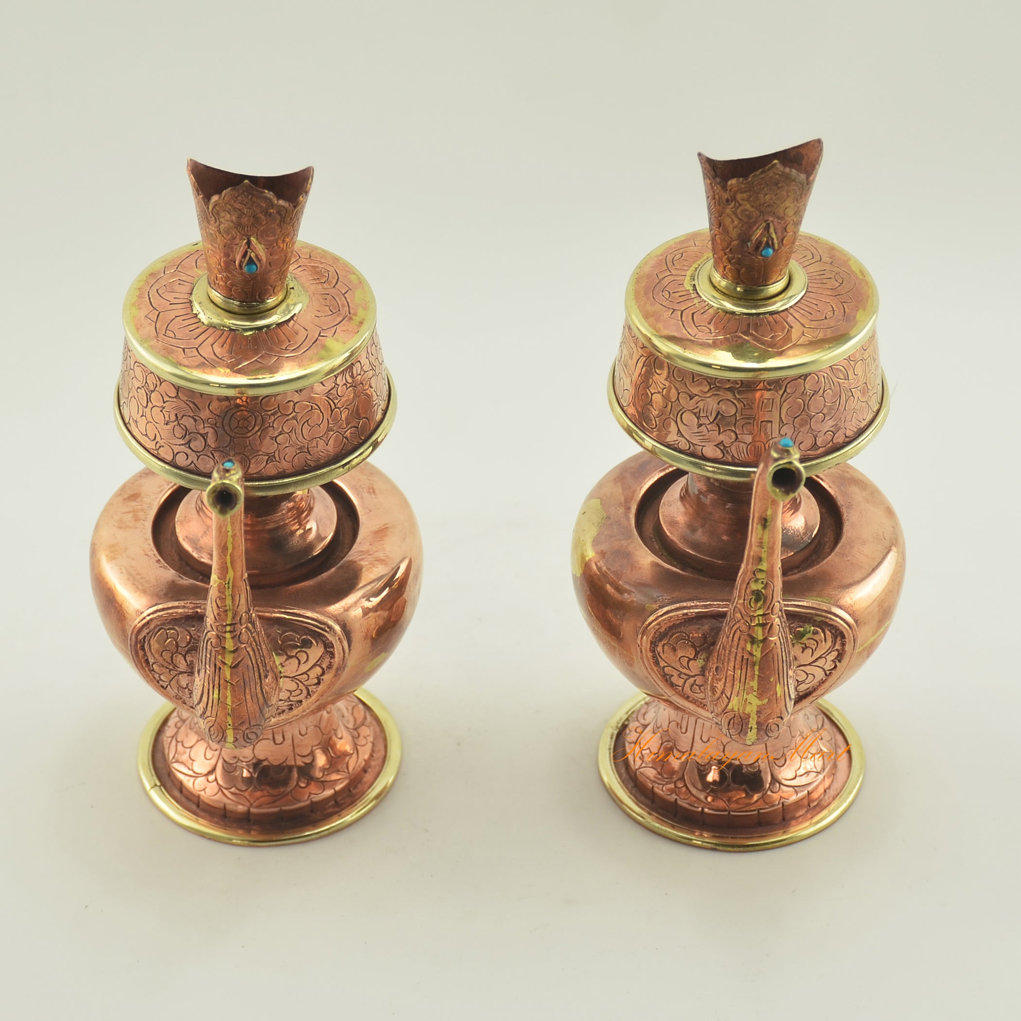 Upper view of Copper Bhumba Offering Set showing brass rings and detailed hand carvings