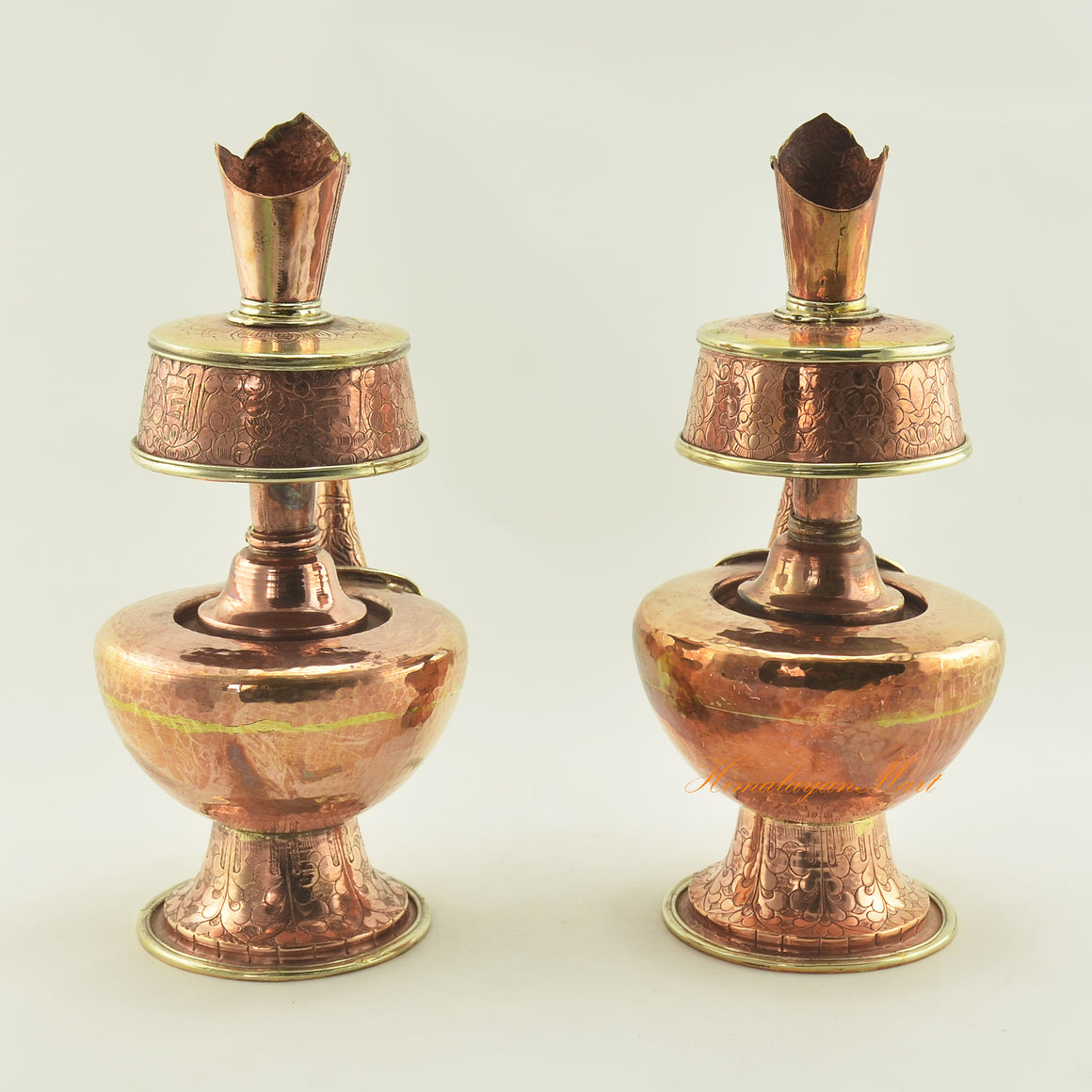 Back view of Copper Bhumpa Vase highlighting traditional hand-carved copper alloy ritual design