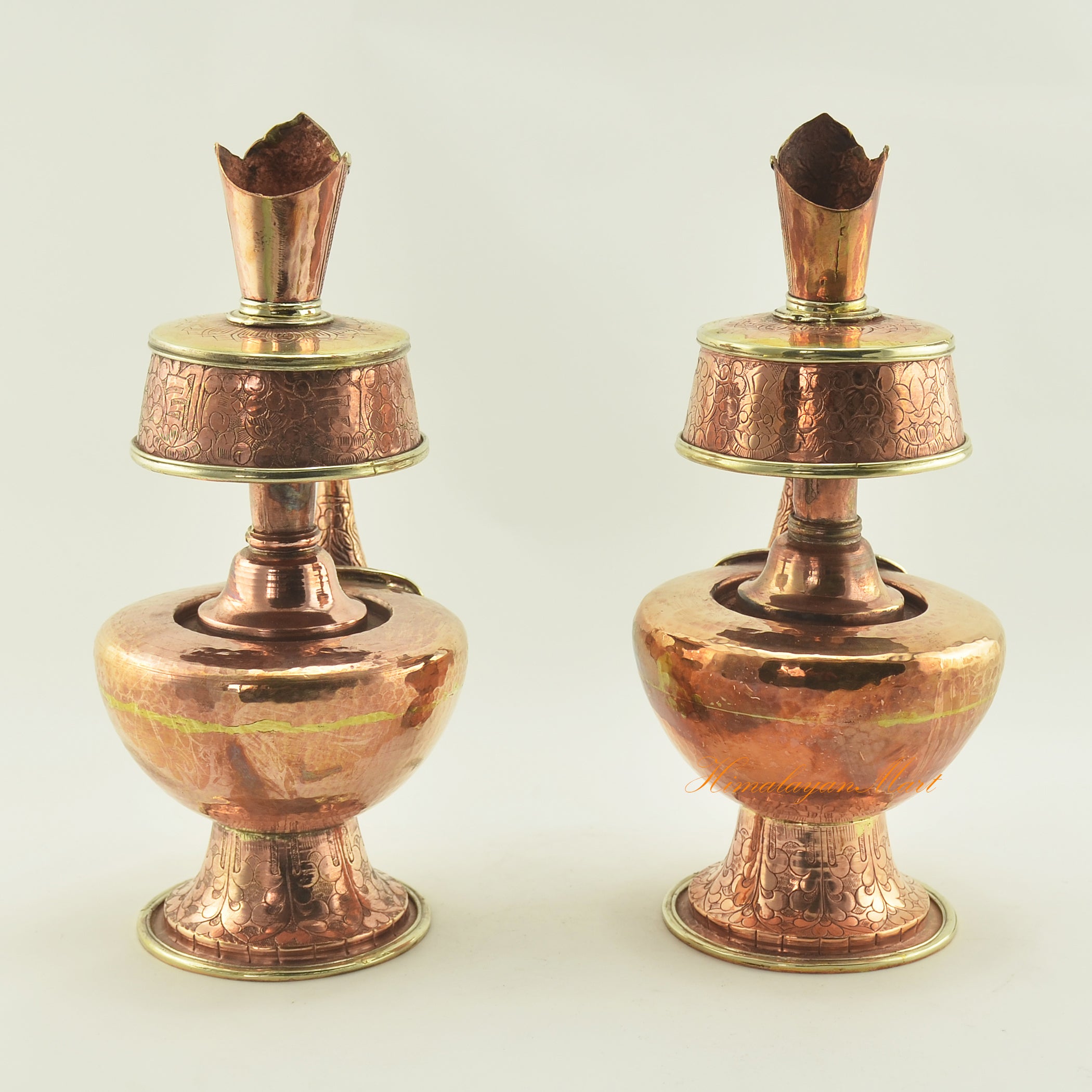 Back view of Copper Bhumpa Vase highlighting traditional hand-carved copper alloy ritual design