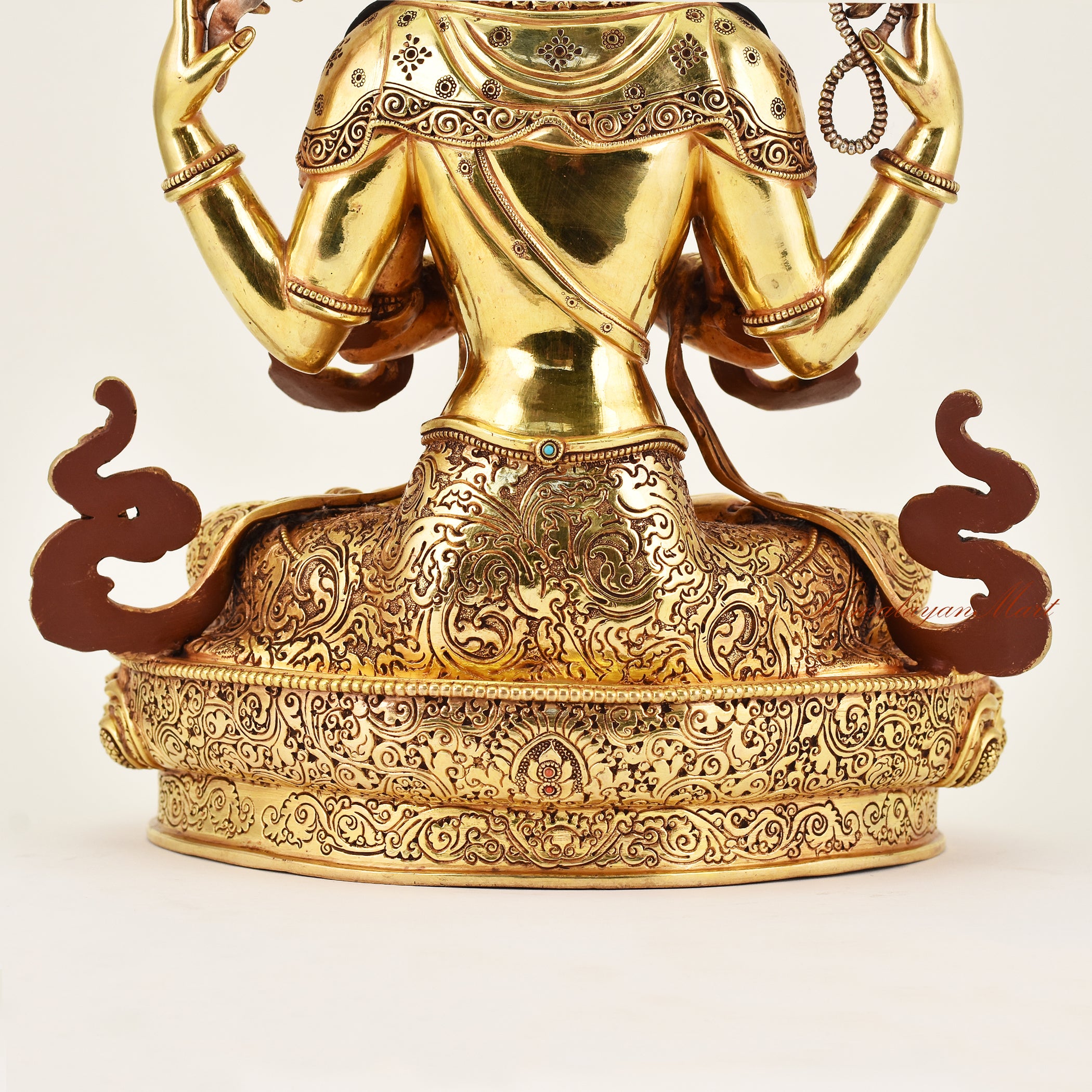 Close-up of the back detail of the Crowned Chenrezig statue, emphasizing intricate carving, flowing robes, and meticulous handcrafted craftsmanship.