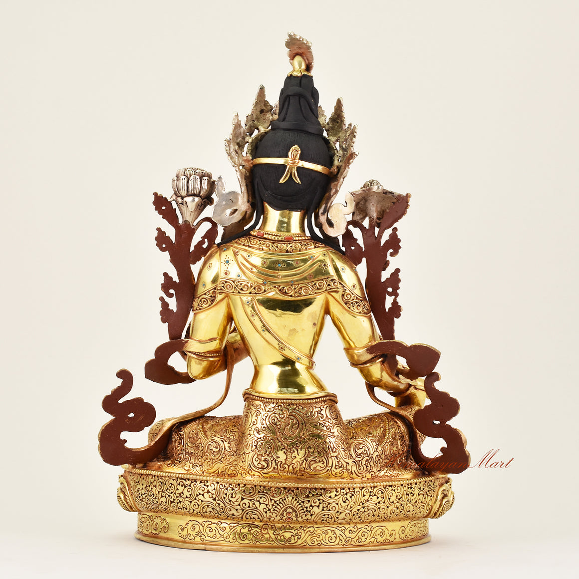 Back view of a handcrafted Crowned Green Tara statue, revealing detailed robes, intricate carving, and fine Buddhist sculptural artistry.