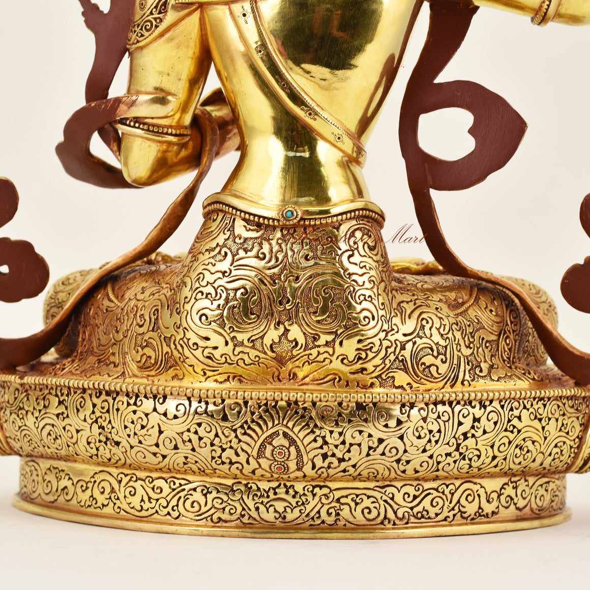 Close-up of the back detail of the Crowned Manjushri statue, emphasizing intricate carving, decorative features, and handcrafted Buddhist artistry.