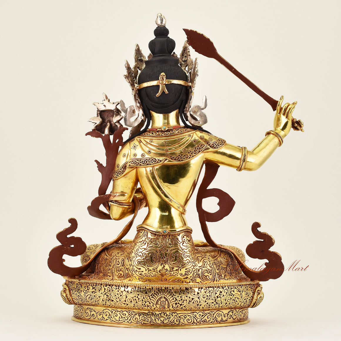 Back view of a handcrafted Crowned Manjushri statue, revealing detailed ornamentation, fine robes, and meticulous Buddhist artistry.