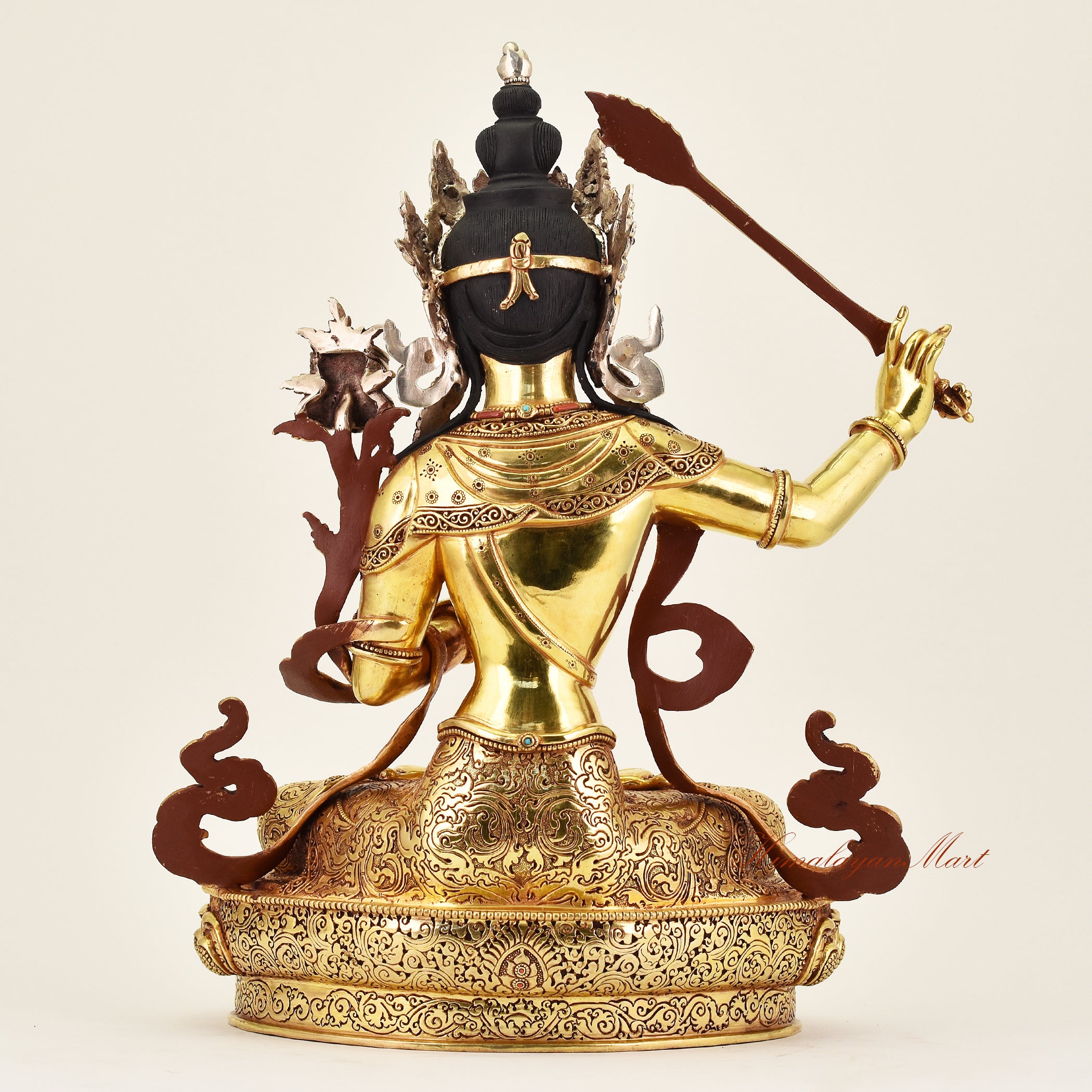 Back view of a handcrafted Crowned Manjushri statue, revealing detailed ornamentation, fine robes, and meticulous Buddhist artistry.