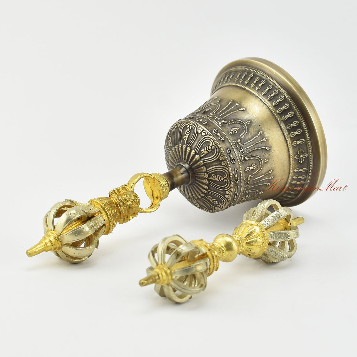 Angled left view of gold-plated Tibetan Dorje and Drilbu Set showing bell and vajra proportions
