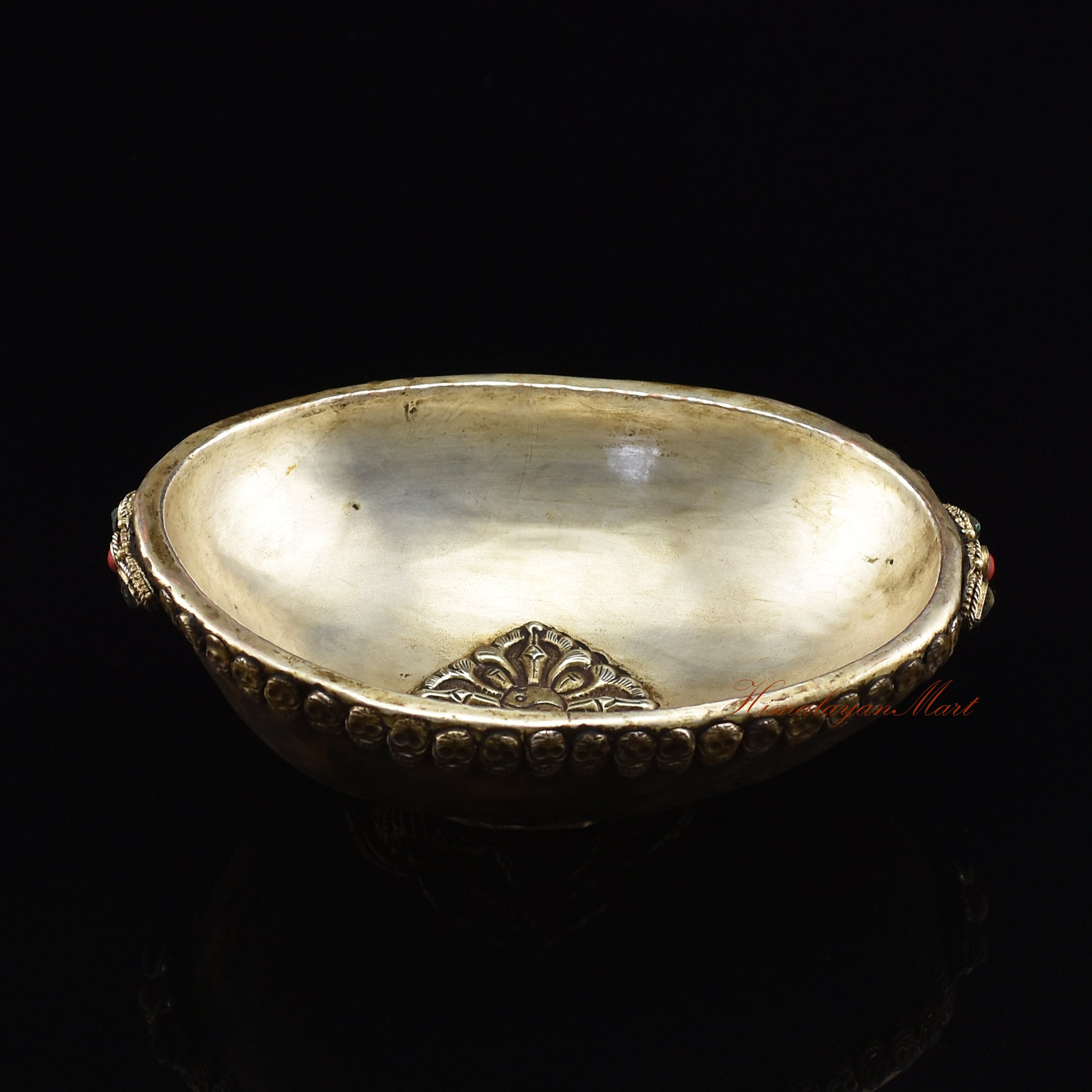 Dragon-embedded resin kapala, angled view highlighting embedded dragon motif