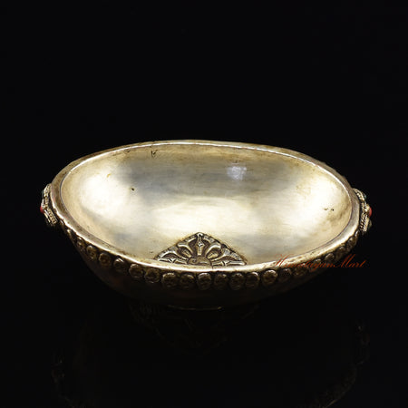 Dragon-embedded resin kapala, angled view highlighting embedded dragon motif