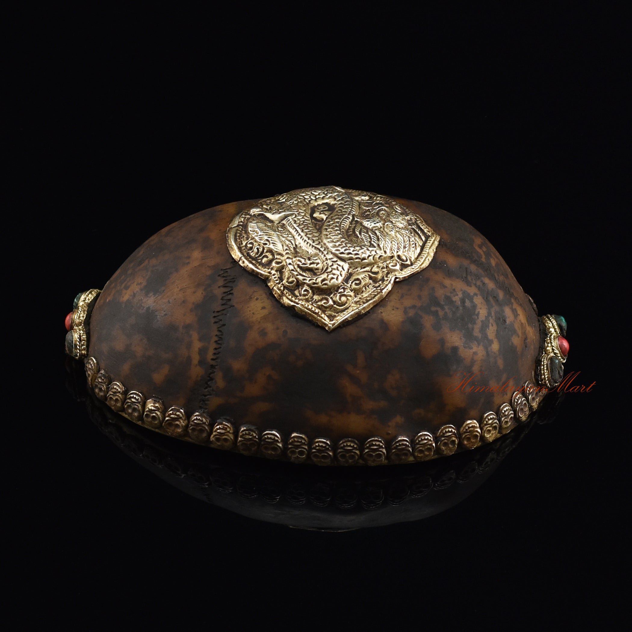 Dragon-embedded resin kapala, right side view with silver-plated copper accents
