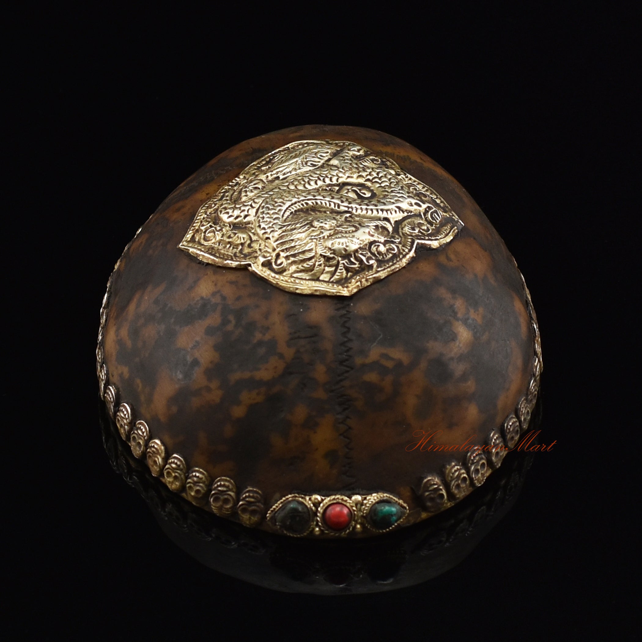 ragon-embedded resin kapala, top view showing kapala design