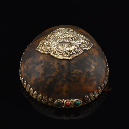 ragon-embedded resin kapala, top view showing kapala design